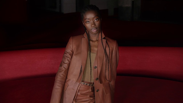 Video Reference: Lip, Hand, Shoulder, Human body, Neck, Textile, Sleeve, Flash photography, Couch, Fashion design