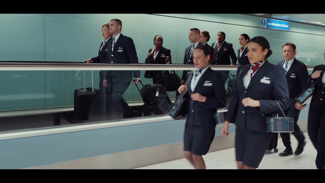 Video Reference: Clothing, Trousers, Outerwear, Coat, Tie, Suit, Gesture, Motor vehicle, Security, Blazer