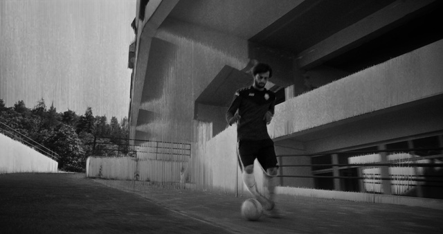 Video Reference: Atmosphere, Shorts, Soccer, Flash photography, Sports equipment, Standing, Football, Black-and-white, Style, Ball