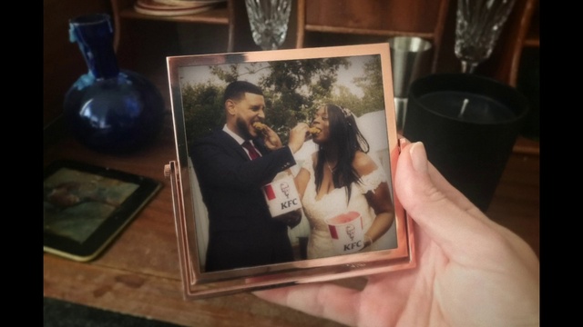 Video Reference: Picture frame, Coat, Smile, Gesture, Flash photography, Suit, Tableware, Art, Formal wear, Event