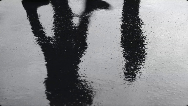 Video Reference: Water, Liquid, Road surface, Asphalt, Gesture, Grey, Black-and-white, Tints and shades, Font, Monochrome photography