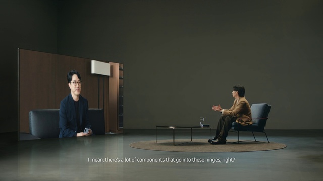 Video Reference: Chair, Entertainment, Event, Public speaking, Performing arts, Sitting, Conversation, Room, Performance, Flooring