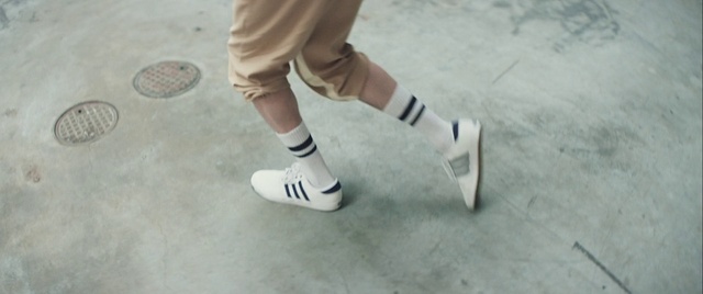 Video Reference: Footwear, Shoe, Leg, Shorts, Sports equipment, Sneakers, Sportswear, Flooring, Sock, Knee