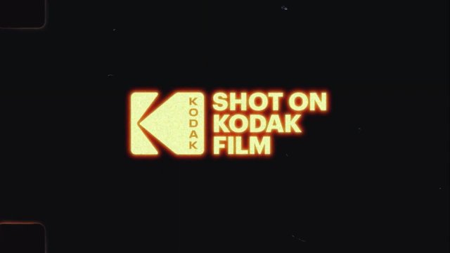 Video Reference: Kodak, film, logo, vintage, title card, brand mark, black background, retro, cinema, film grain