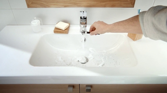 Video Reference: Tap, Bathroom sink, Sink, Plumbing fixture, White, Bathroom, Fluid, Wood, Sleeve, Gesture