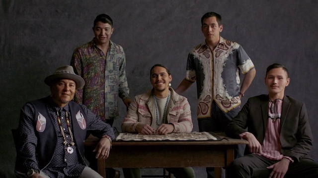 Video Reference: Clothing, Outerwear, Table, Coat, Smile, Hat, Adaptation, Entertainment, Jacket, Performing arts
