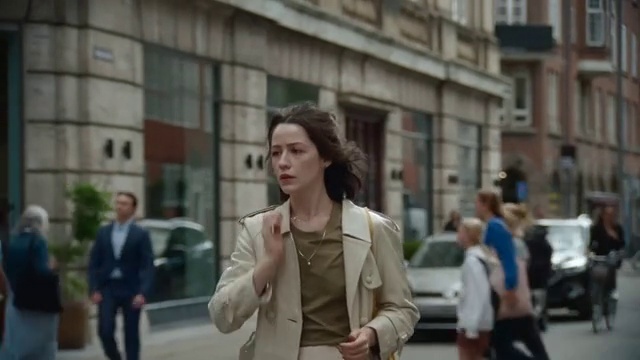 Video Reference: Car, Building, Sleeve, Gesture, Eyewear, Blazer, Road, City, Urban area, Travel