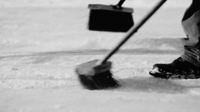 Video Reference: black and white, broom, sweeping, floor cleaning, close up, lower body, shoes, indoor, motion blur, housework, cleaning, work