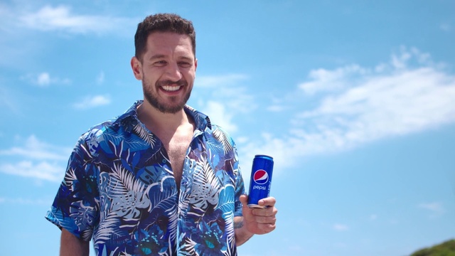 Video Reference: Cloud, Sky, Smile, Blue, Gesture, Tin can, Flash photography, Travel, Leisure, Electric blue