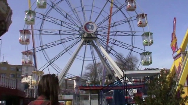 Video Reference: Sky, Wheel, Ferris wheel, Outdoor recreation, Leisure, Automotive wheel system, Recreation, Amusement ride, Event, Pole