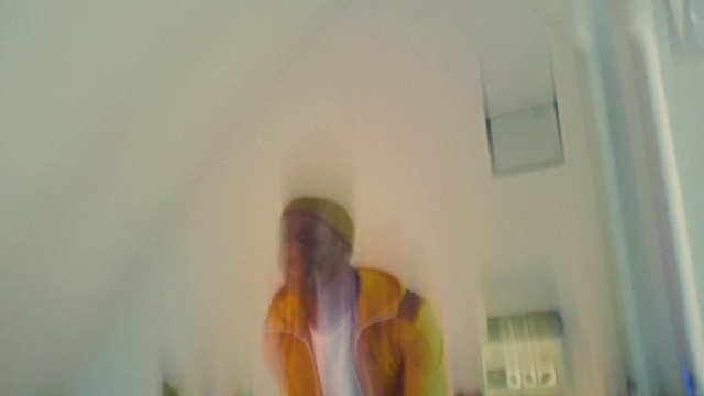 Video Reference: Gesture, Wood, Ceiling, Event, Room, Plaster, Audio equipment, Facial hair, T-shirt, Shadow