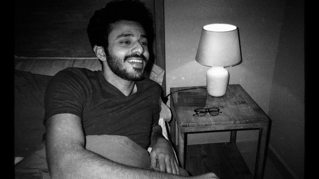 Video Reference: Smile, Hairstyle, White, Black, Flash photography, Beard, Standing, Gesture, Black-and-white, Grey