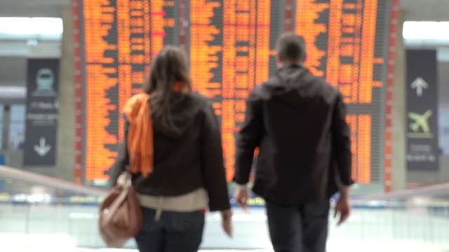 Video Reference: Human, Orange, Textile, Street fashion, Standing, Gesture, Luggage and bags, Bag, City, Fun