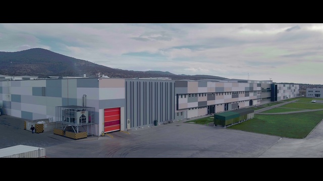 Video Reference: Sky, Cloud, Building, Land lot, Asphalt, Urban design, Window, Residential area, Landscape, Road surface