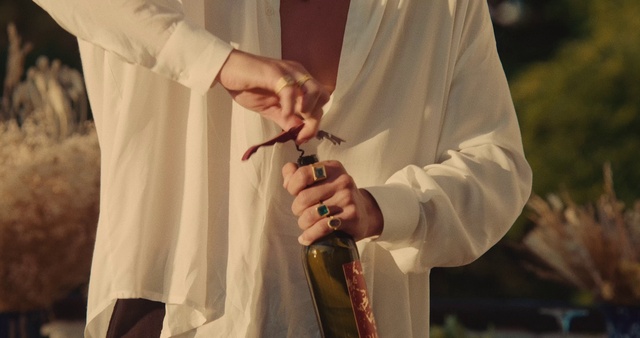 Video Reference: Hand, Outerwear, White coat, Sleeve, Glove, Gesture, Microphone, Religious item, Clergy, Priesthood