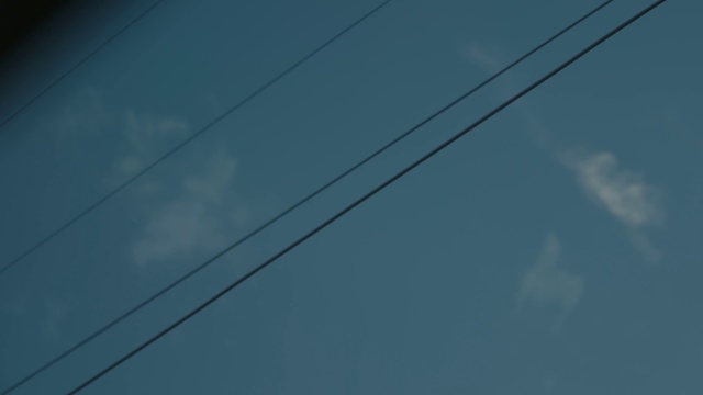 Video Reference: Cloud, Sky, Blue, Electricity, Overhead power line, Cable, Electrical supply, Wire, Electric blue, Calm