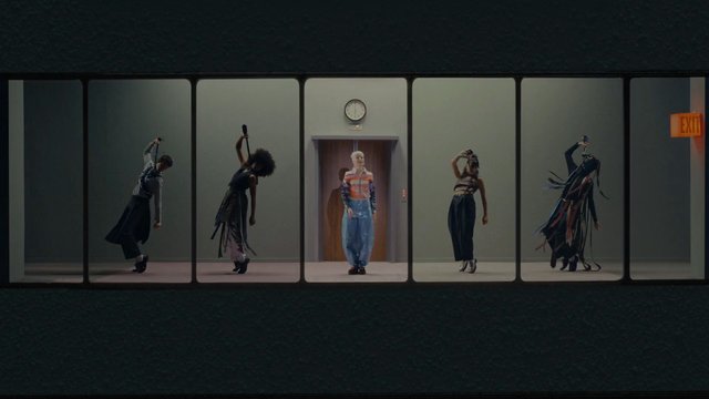 Video Reference: dancers, dance, hallway, elevator, group, performance, pose, minimalist, indoor, modern, fashion, artistic, symmetry, panels, exit sign