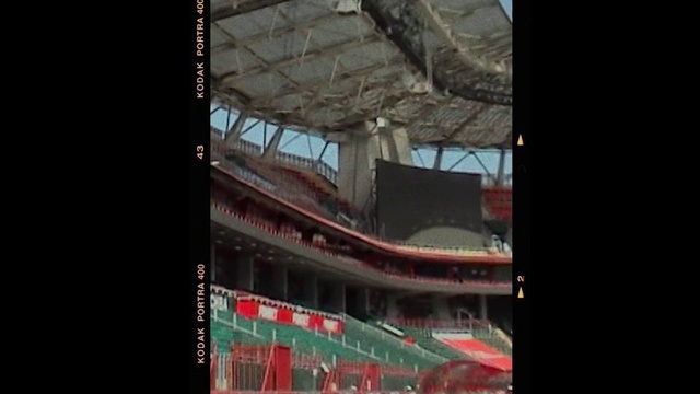 Video Reference: World, Building, City, Display device, Arena, Urban design, Stadium, Advertising, Sport venue, Font