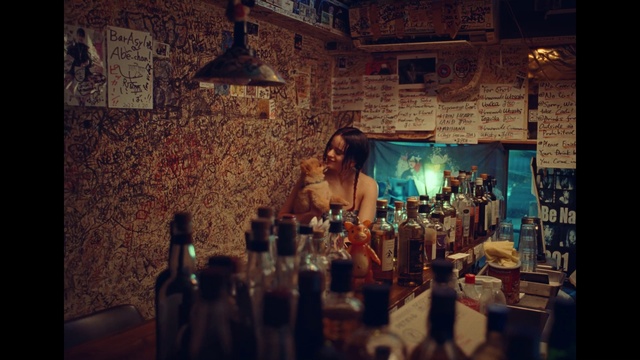 Video Reference: Bottle, Drinkware, Drinking establishment, Tableware, Barware, Table, Alcoholic beverage, Glass bottle, Drink, Picture frame