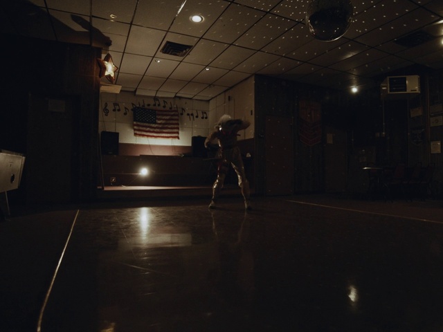 Video Reference: Flash photography, Grey, Flooring, Entertainment, Floor, Tints and shades, Hall, Building, Space, Darkness