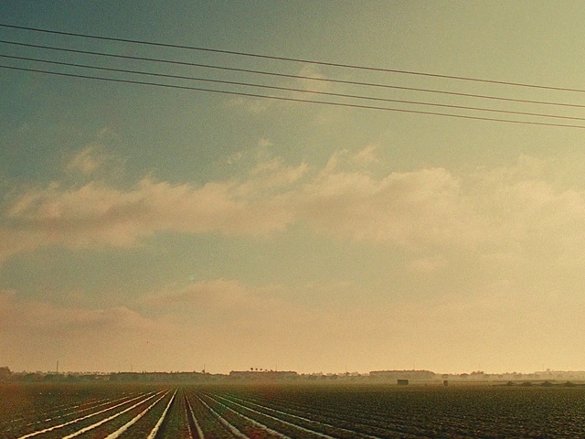 Video Reference: Cloud, Sky, Daytime, Light, Land lot, Line, Grass, Atmospheric phenomenon, Electricity, Overhead power line