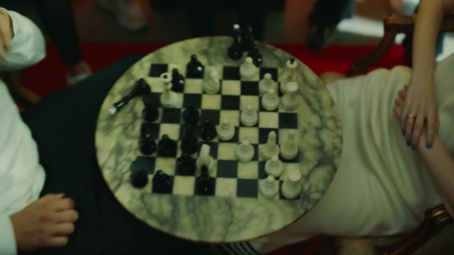 Video Reference: Chessboard, Chess, Table, Board game, Indoor games and sports, Recreation, Competition event, Ingredient, Tabletop game, Chair