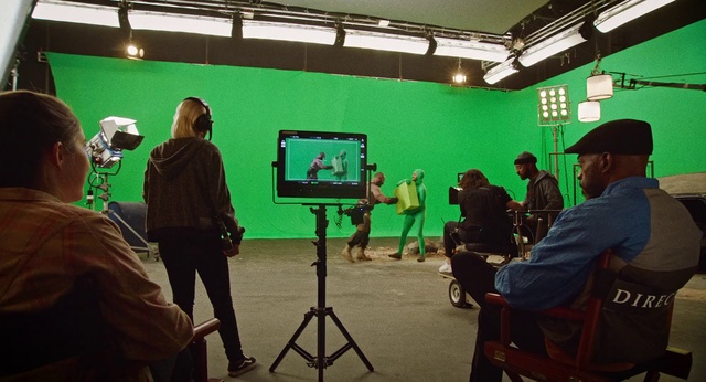 Video Reference: Tripod, Building, Television, Art, T-shirt, Television crew, Event, Electronic device, Technology, Display device