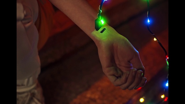 Video Reference: Light, Gesture, Entertainment, Finger, Christmas ornament, Visual effect lighting, Event, Electricity, Wrist, Fun