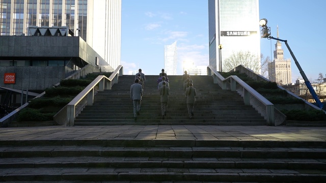 Video Reference: Sky, Building, Skyscraper, Stairs, Road surface, Tower block, Morning, Urban design, City, Facade