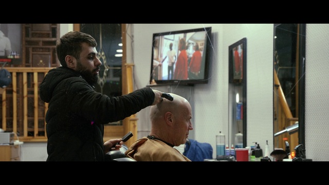 Video Reference: Muscle, Electronic device, Display device, Event, T-shirt, Gadget, Multimedia, Suit, Audio equipment, Television