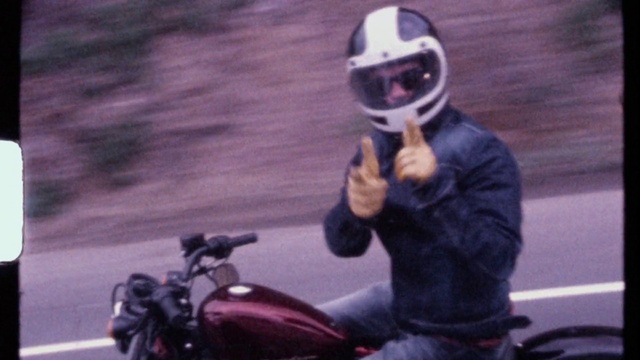 Video Reference: Vehicle, Photograph, Helmet, Automotive lighting, Automotive tire, Motorcycle helmet, Motorcycle, Gesture, Automotive mirror, Motor vehicle