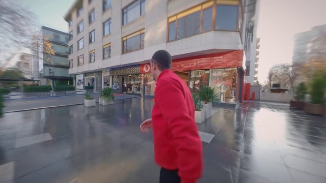 Video Reference: Plant, Window, Building, Road surface, Urban design, Travel, Leisure, City, Event, Sidewalk