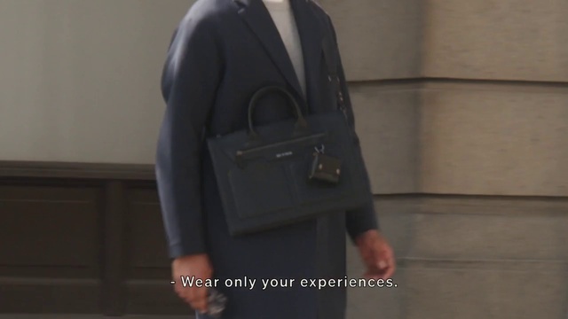 Video Reference: Sleeve, Bag, Gesture, Luggage and bags, Collar, Street fashion, Waist, Blazer, Formal wear, Flash photography