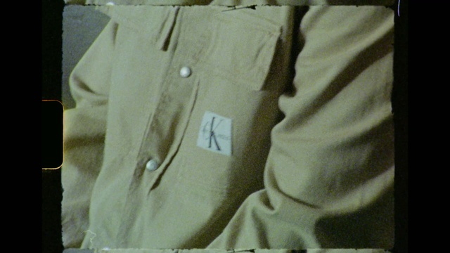 Video Reference: Brown, Sleeve, Collar, Dress shirt, Rectangle, Blazer, Beige, T-shirt, Button, Pattern