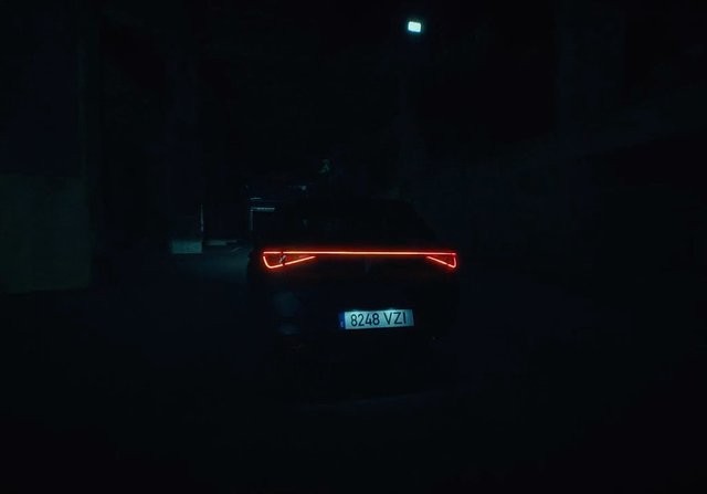 Video Reference: car, rear view, tail lights, night, dark alley, vehicle, license plate, street, low light, automobile, back view