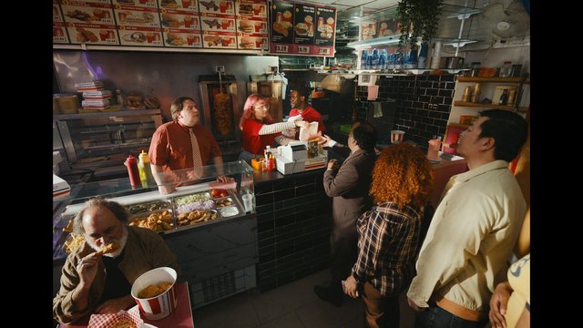 Video Reference: fast food, fried chicken, burger shop, restaurant interior, queue, customers, cashier, food counter, menu board, takeaway, serving food, busy, indoor, snack shop, street food, diner