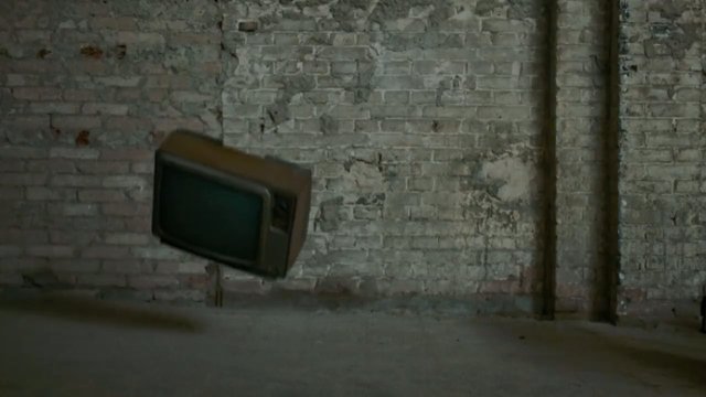 Video Reference: television, vintage, retro, brick wall, indoor, empty room, dim light, old tv, rustic, studio, industrial, minimal