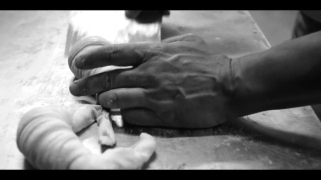 Video Reference: black and white, hands, close-up, manual work, craft, assembly, table, tool use, workspace, detail, motion blur
