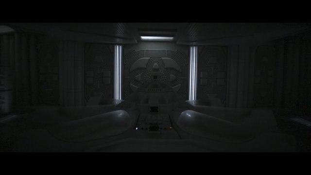 Video Reference: sci-fi, interior, spaceship, futuristic, dark, symmetrical, console, corridor, paneling, metallic, ambient light, alien, control room, industrial, minimal, empty
