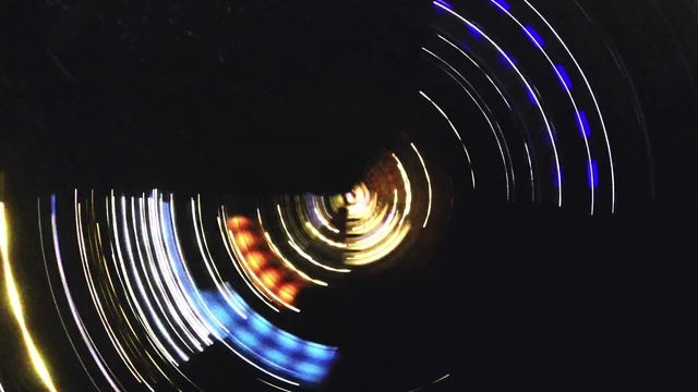 Video Reference: Gas, Circle, Electric blue, Electricity, Event, Darkness, Space, Entertainment, Art, Spiral