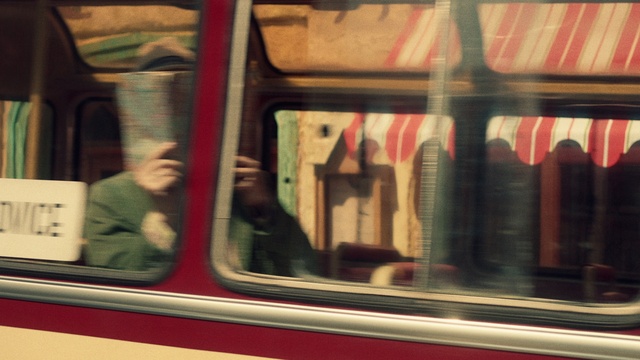 Video Reference: Train, Rectangle, Vehicle, Motor vehicle, Fixture, Tints and shades, Public transport, Passenger, Metal, Travel