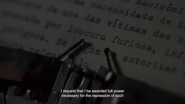 Video Reference: typewriter, close-up, printed text, document, subtitles, low light, macro, paper, typing, literature, film still, dark, text