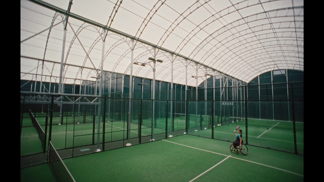 Video Reference: Field house, Building, Plant, Shade, Line, Grass, Racquet sport, Leisure, Chair, Net