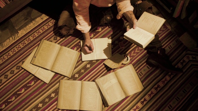 Video Reference: Wood, Book, Publication, Hardwood, Music, Flooring, Event, Room, Musical instrument accessory, Font