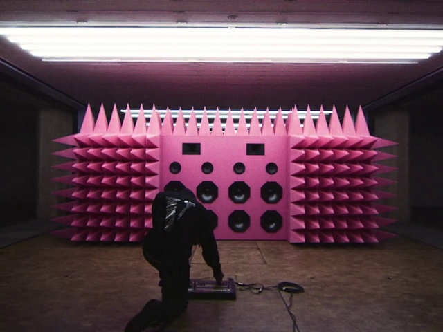 Video Reference: Lighting, Automotive design, Entertainment, Audio equipment, Wall, Bicycle wheel, T-shirt, Magenta, Tire, Flooring