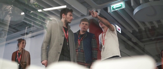 Video Reference: Sleeve, Standing, Gesture, Jacket, Blazer, Engineering, Event, Audio equipment, Automotive design, Fun