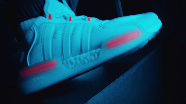 Video Reference: Automotive lighting, Personal protective equipment, Sneakers, Magenta, Electric blue, Bumper, Walking shoe, Human leg, Athletic shoe, Font