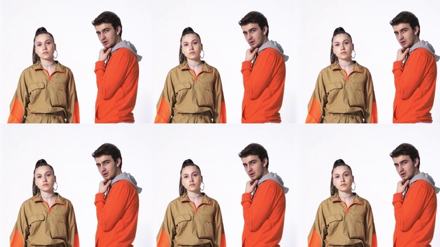 Video Reference: Clothing, Outerwear, Photograph, Facial expression, White, Human, Fashion, Neck, Orange, Sleeve