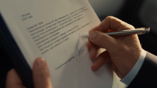 Video Reference: document, signature, signing, hands, pen, paper, close-up, contract, agreement, office, business, paperwork, legal, text, indoors