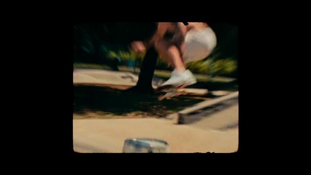 Video Reference: Flash photography, Gesture, Font, Gadget, Tints and shades, Grass, Display device, Human leg, Darkness, Multimedia